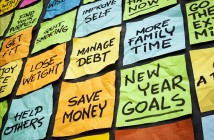 new year goals or resolutions - colorful sticky notes on a blackboard