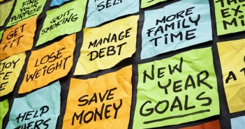 New Years Money Resolutions That Anyone Can Keep new year goals or resolutions - colorful sticky notes on a blackboard