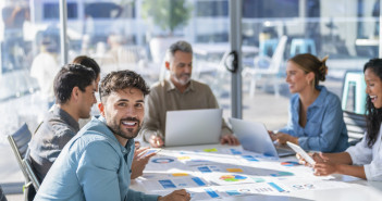 5 Career Tips from Marketing Leaders Young man sitting at a business meeting.