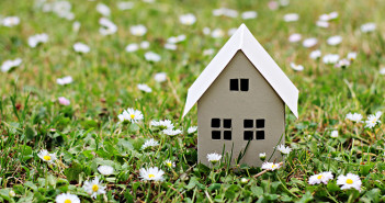 Paper house on the grass