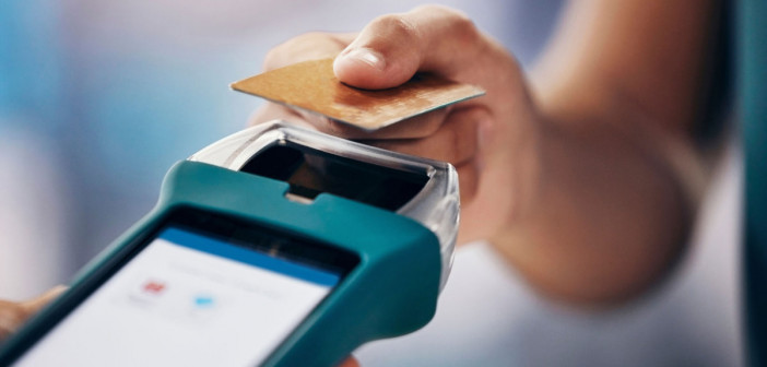 Credit card payment, shopping and closeup at digital nfc terminal for money, pos or cashier at shop. Woman, hand and card for service, discount or cashless purchase with retail, tech or help at store