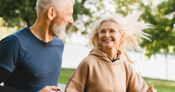 Mature,Middle,Aged,Senior,Couple,Running,Together,In,The,Park