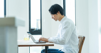 Japanese,Man,Working,On,A,Computer,At,Home