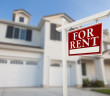 Red,For,Rent,Real,Estate,Sign,In,Front,Of,Beautiful