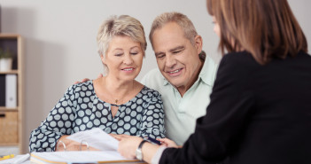 Sweet,Senior,Couple,Listening,To,A,Female,Mortgage,Agent,Explaining