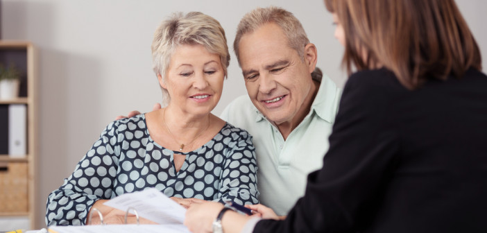 Sweet,Senior,Couple,Listening,To,A,Female,Mortgage,Agent,Explaining