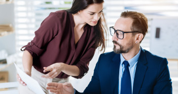 Important,Element.,Concerned,Concentrated,Two,Colleagues,Studying,Document,While,Woman