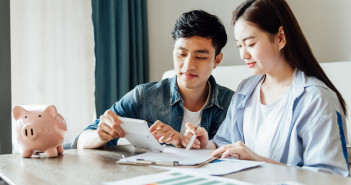 5 tips to help you get a head start on your financial planning A,Young,Asian,Couple,Is,Sitting,On,A,Carpet,Using
