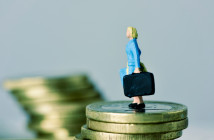 Closeup,Of,A,Miniature,Woman,Carrying,A,Suitcase,,On,The