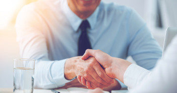 Good,Deal.,Close-up,Of,Two,Business,People,Shaking,Hands,While