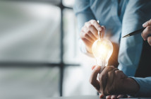 Businessman,Holds,A,Glowing,Lamp,,Creative,New,Idea.,Innovation,,Brainstorming,
