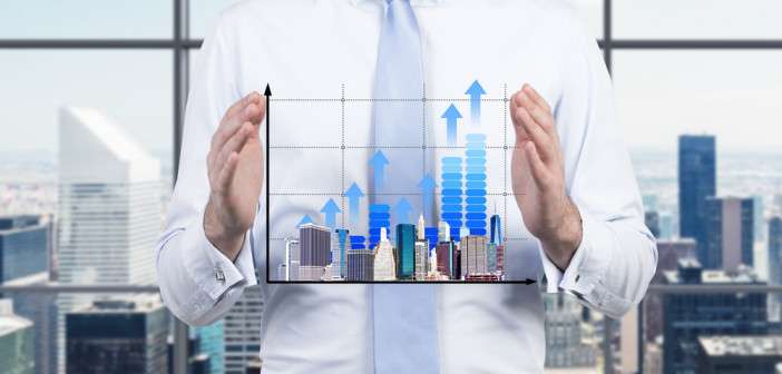 Businessman,Is,Holding,A,Bar,Chart.,A,Concept,Of,Development.