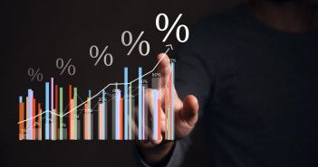 Interest,Rates,And,Dividends,,Business,People,Calculate,And,Higher,Graphs