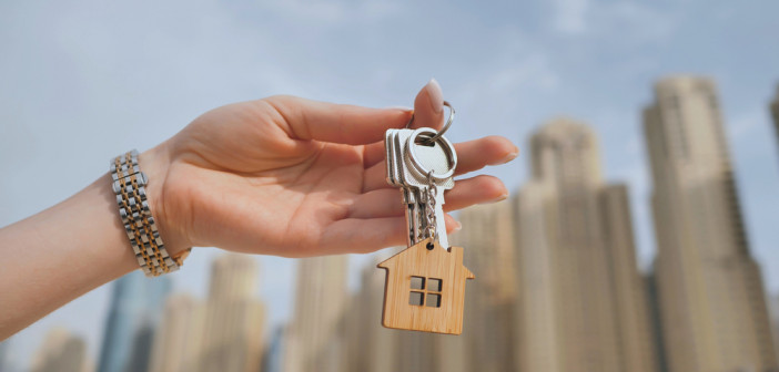 The,Concept,Of,Buying,An,Apartment.,Girl,Holds,The,Keys