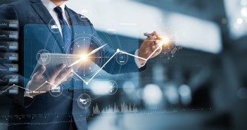 Navigating finances can be overwhelming for new college grads. Here are some tips Businessman,Using,Tablet,Analyzing,Business,Growth,Graph,Data,And,Progress,