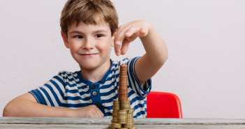Boy,Building,Stack,Of,Money.,Financial,Safety,,Investment,Building,Concept.