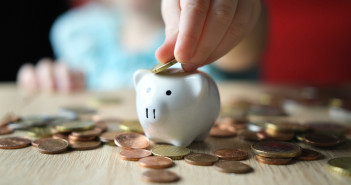 Close-up,Of,Hands,Of,Small,Child,Manipulate,With,Metal,Coins,