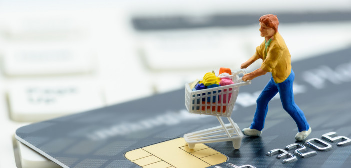 Miniature,Figurine,:,A,Shopper,Pushes,A,Shopping,Cart,On