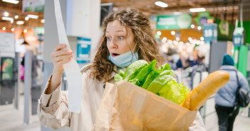 Young,Woman,In,A,Medical,Mask,Looks,Shocked,At,A