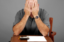 Man,Showing,Signs,Of,Stress,While,Working,Budget