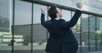 Close,Up,Happy,Businessman,Celebrating,Victory,Near,Modern,Building.,Young