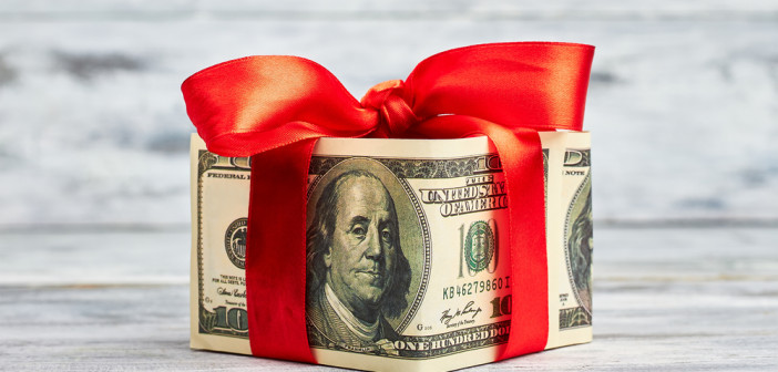Dollars,Wrapped,By,Red,Bow.,Money,Is,Best,Present.