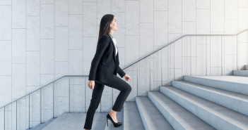 Road,To,Success,Concept,With,Businesswoman,Climbing,The,Stairs,In