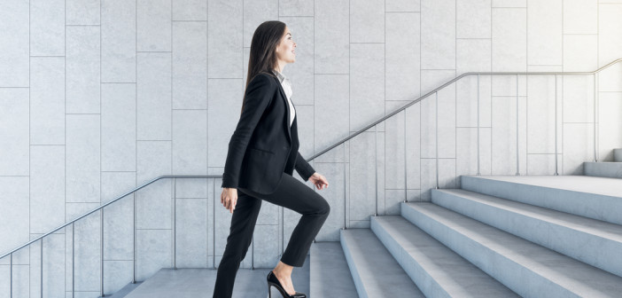 Road,To,Success,Concept,With,Businesswoman,Climbing,The,Stairs,In