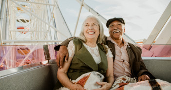 Cheerful,Senior,Couple,Enjoying,A,Ferris,Wheel,By,The,Santa