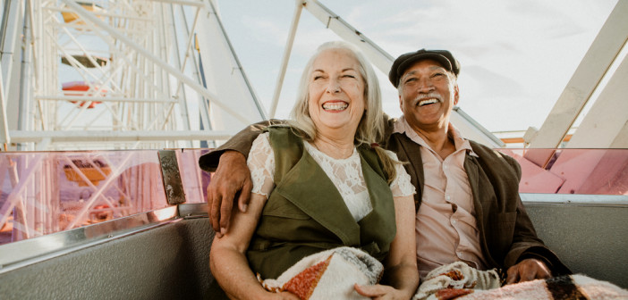 Cheerful,Senior,Couple,Enjoying,A,Ferris,Wheel,By,The,Santa