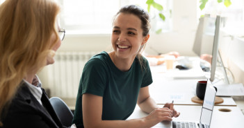 Pleasant,Workday.,Two,Women,Colleagues,Employees,Of,Diverse,Age,Sharing