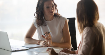 Two,Diverse,Serious,Businesswomen,Discussing,Business,Project,Working,Together,In