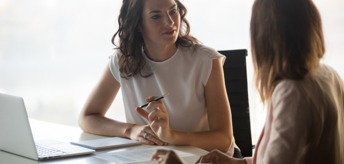 Two,Diverse,Serious,Businesswomen,Discussing,Business,Project,Working,Together,In