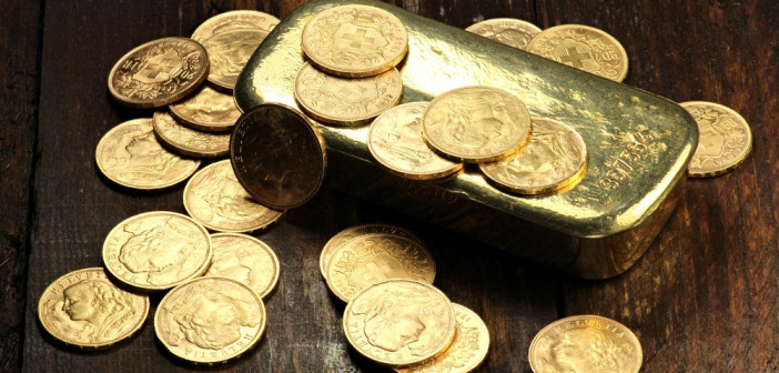 Swiss,Vreneli,Gold,Coins,And,A,Gold,Ingot,On,Wooden