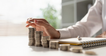 Young,Asian,Woman,Making,Stack,Of,Coin.,Invest,Save,Finance