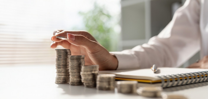 Young,Asian,Woman,Making,Stack,Of,Coin.,Invest,Save,Finance