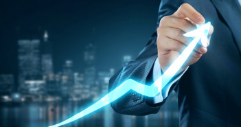 Close,View,Of,Businessman,Drawing,On,Screen,Growing,Graph