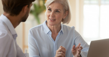 Middle,Aged,Old,Businesswoman,Manager,Mentor,Speaking,To,Businessman,Client