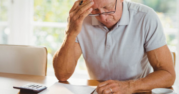 Worried,Senior,Man,With,Tax,Documents,At,Home