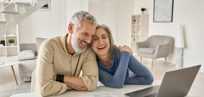 Happy,Mature,Older,Family,Couple,Laughing,,Bonding,Sitting,At,Home