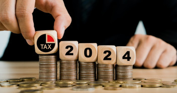 Tax,2024.hand,Putting,Tax,Icon,In,The,Wooden,Cube,For