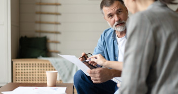 Middle,Aged,Senior,Old,Couple,Holding,Documents,Reading,Paper,Bills