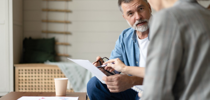 Middle,Aged,Senior,Old,Couple,Holding,Documents,Reading,Paper,Bills