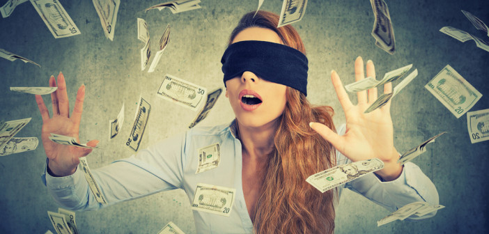 Blindfolded,Young,Entrepreneur,Businesswoman,Trying,To,Catch,Dollar,Bills,Banknotes