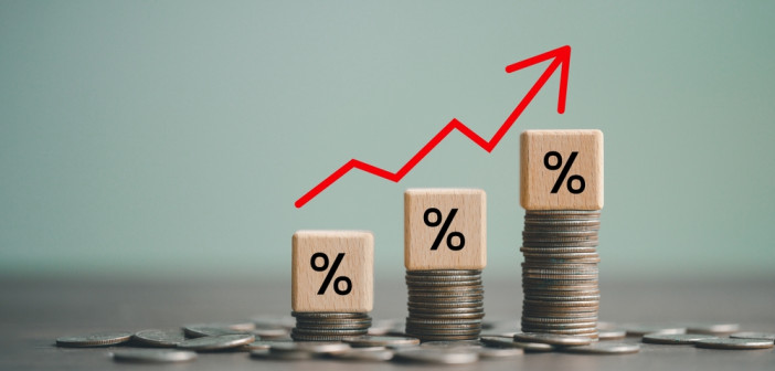 Inflation,Concept,,Red,Graph,Arrow,,Percent,Sign,On,A,Wooden