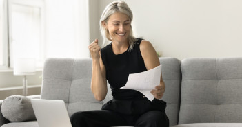 Happy,Successful,Mature,Investor,Woman,Celebrating,Profit,,Income,From,Investment,
