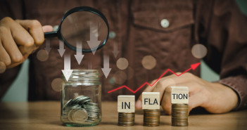Inflation,Word,On,A,Wooden,Cube,On,Coins,In,Idea