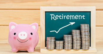 Pink,Piggy,Save,Money,And,Retirement,Text,With,Coin,In