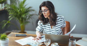 A,Smart,Business,Woman,Who,Keeps,A,Paper,Account,Using